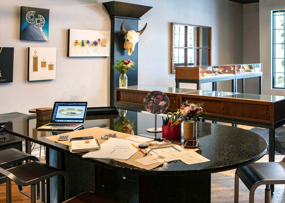 Ellie Thompson's design table inside of her store