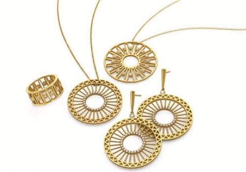 collection of gold hoop jewelry on white background
